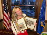 Rep. Vining holding photos of her districts