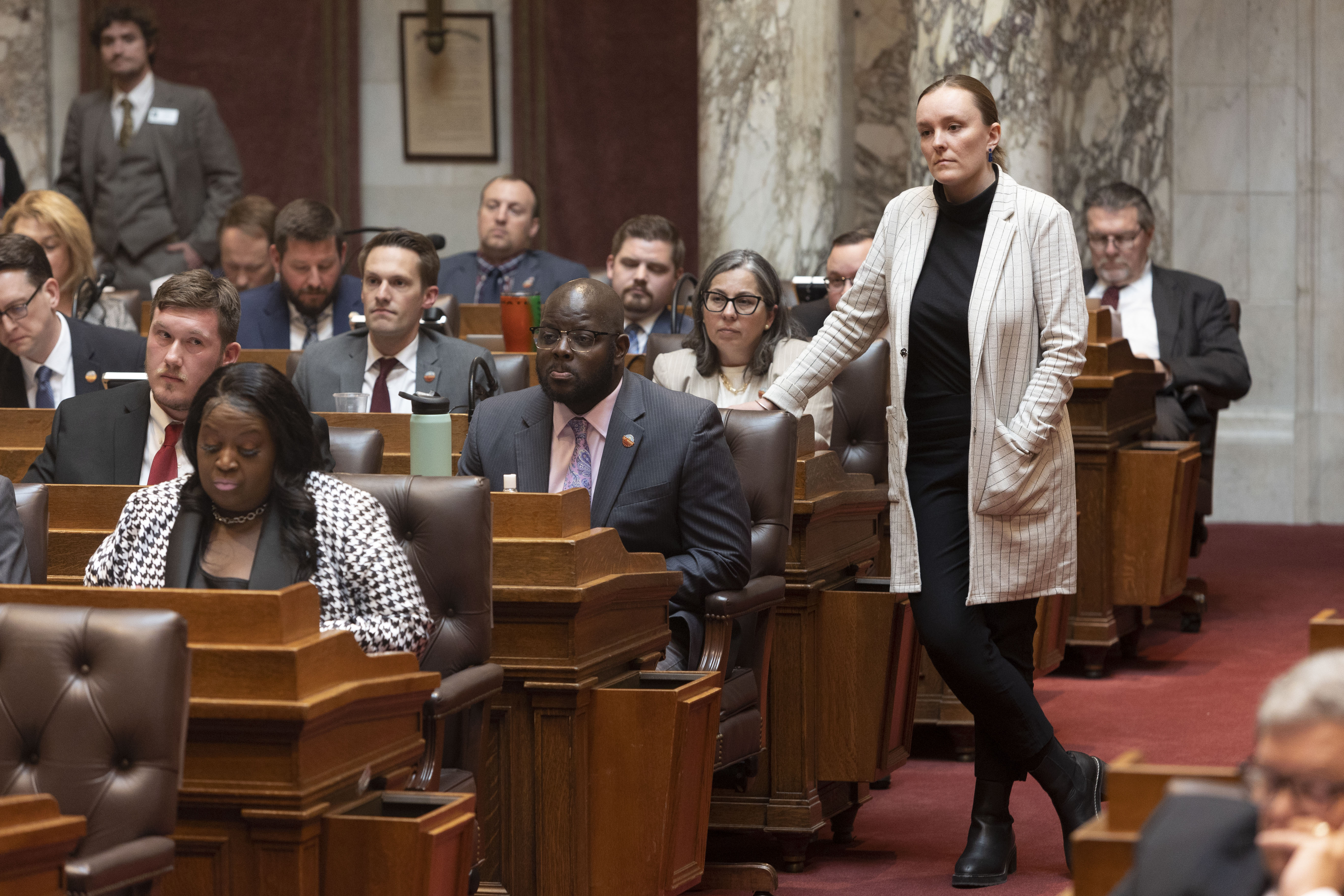 Rep. Neubauer listening to a floor speech in the State Assembly