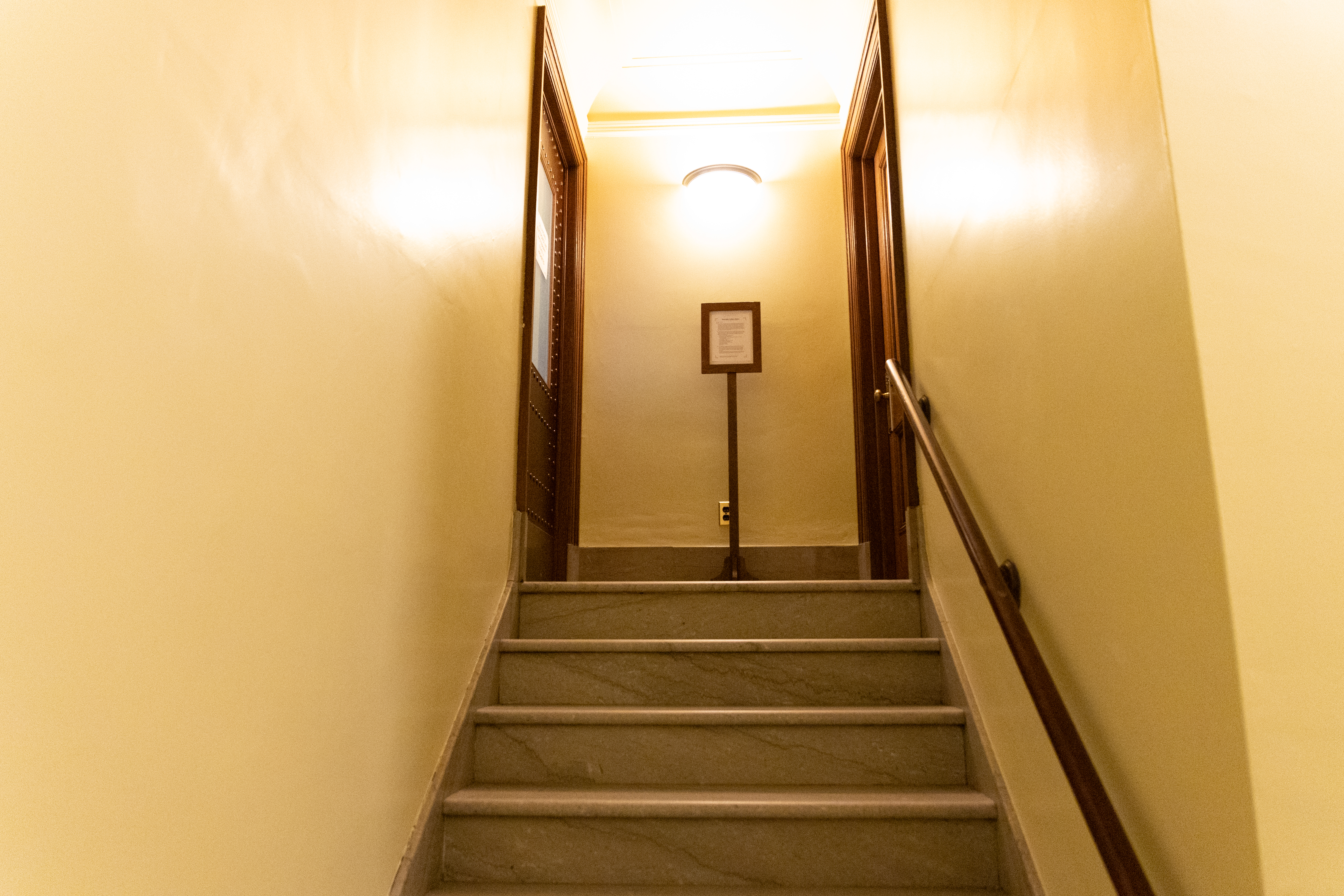 Here are the stairs that lead to the Assembly locker room on the right and the West gallery entrance on the right.