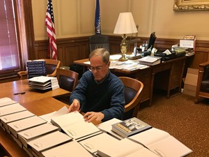 Signing Blue Books for the District