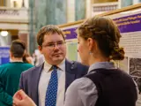 Sen. Spreitzer speaks with a Wisconsinite at the State Capitol during the University of Wisconsin Research in the Rotunda event. 