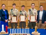 Sen. Spreitzer and Rep. Jacobson present legislative citations to constituents earning the rank of Eagle Scout. 