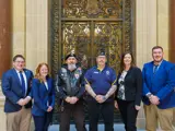 Sen. Spreitzer stands with legislative colleagues and local veterans in front of the Senate Parlor. 