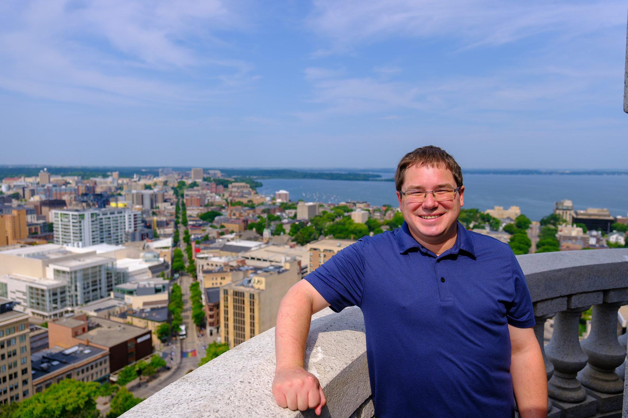 Sen. Spreitzer stands at the top of the Capitol dome in Madison.