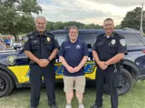  Sen. Spreitzer poses with local police chiefs at Evansville Night Out. 