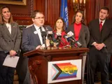 Sen. Spreitzer speaks at a press conference announcing the Legislative LGBTQ+ Caucus’ Equality Agenda while legislative colleagues look on.  