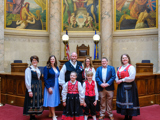 Sen. Spreitzer and Rep. Jacobson stand in the Senate Chamber with constituents at the annual Capitol Syttende Mai celebration. 