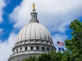 The State Capitol building is pictured in the sunshine. 