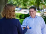 Sen. Spreitzer delivers a Wisconsin Blue Book.  