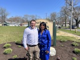 Sen. Spreitzer stands with former Beloit City Council President Regina Dunkin in front of a sign for the park named in her honor.