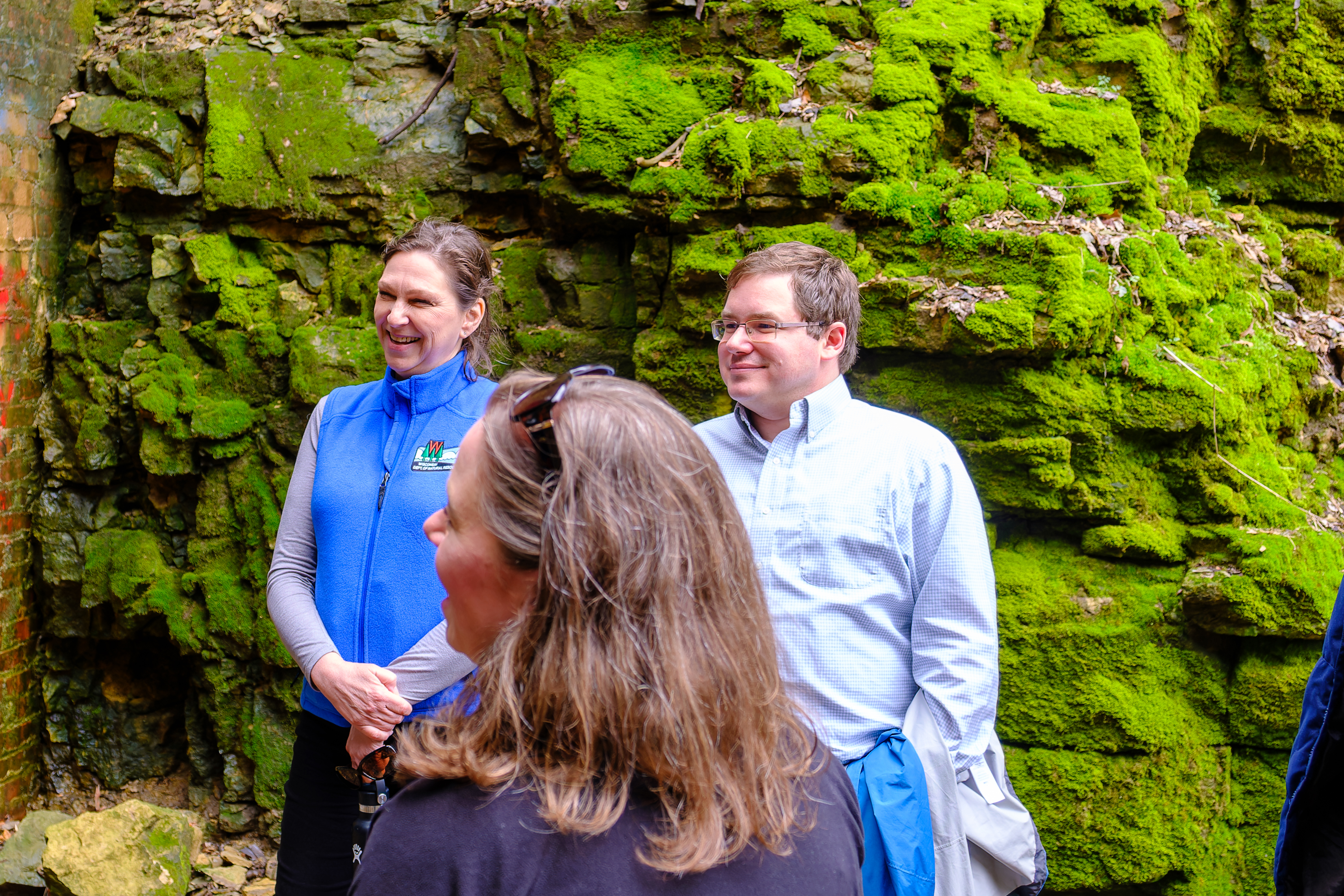 Sen. Spreitzer speaks with Lieutenant Governor Sara Rodriguez and DNR staff near the Badger State Trail.