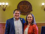 Sen. Spreitzer smiles with Lieutenant Governor Sara Rodriguez. 