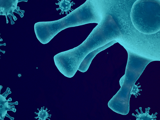 A stylized graphic on a dark blue background with cyan outlines of the COVID-19 virus floating around.