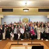 Senator Smith in the Joint Finance Room of the State Capitol with a large group of student nurses and working nurses who are meeting for the Nurses Association Lobby Day.