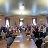 Sen. Smith with about 40 constituents in a group photo in a hearing room in the Capitol for the Xcel Lobby Day.
