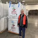 Senator Jeff Smith standing next to Chippewa Valley Bean produce