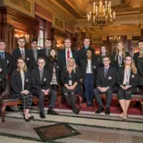 A group of Senate Scholars posing in the Senate Parlor with Civics Education Coordinator, Dr. Tammy Wehrle.