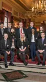 A group of Senate Scholars posing in the Senate Parlor with Civics Education Coordinator, Dr. Tammy Wehrle.