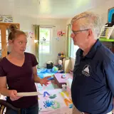 Senator Smith talking with Julia Bennker about childcare.