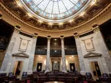 Photo of the Senate Chamber interior and stained-glass ceiling.