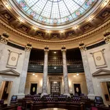 Photo of the Senate Chamber interior and stained-glass ceiling.