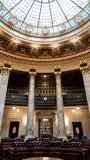 Photo of the Senate Chamber interior and stained-glass ceiling.