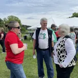 Senator Smith and Representative Jodi Emerson talking with a constituent at the Eau Claire Dairy Breakfast.