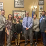 Senator Smith posing with representatives from the Chippewa Valley YMCA on their capitol visit.