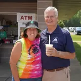 Senator Smith enjoying a milkshake and posing with his friend Jodi at the Eau Claire County Fair.