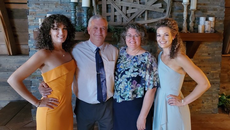 Jeff with his wife, Sue, and two daughters at a family wedding
