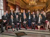 A group of Senate Scholars posing in the Senate Parlor with Civics Education Coordinator, Dr. Tammy Wehrle.