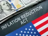 Clipart of a dollar bill, a partial American flag, and the words "Inflation Reduction Act. 