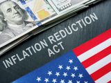 Clipart of a dollar bill, a partial American flag, and the words "Inflation Reduction Act. 