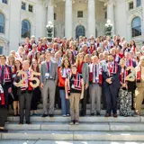 Sen. Smith with Xcel Lobby Day Attendees in a group photo on the Capitol stairs outside